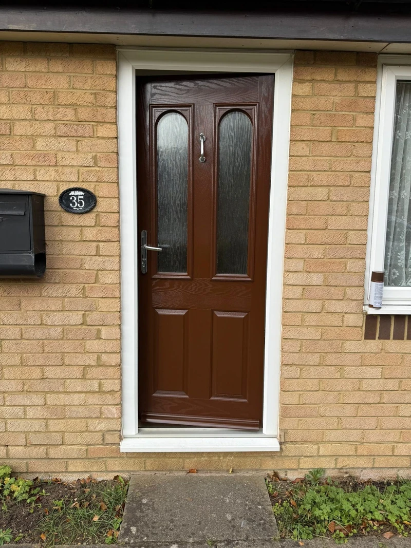 Brown front door with glass panel - expert door spraying
