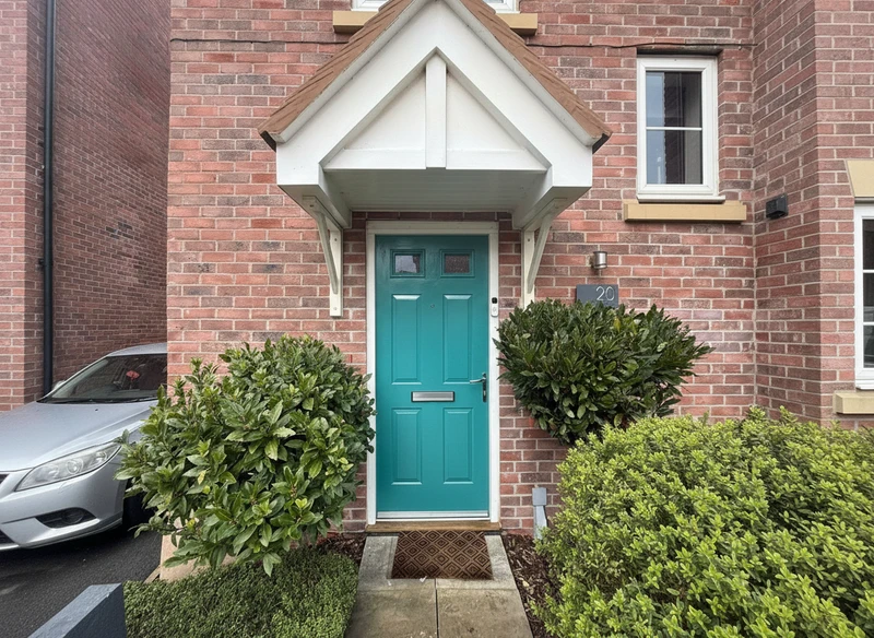 Teal front door with canopy porch and hedges - door respray Birmingham