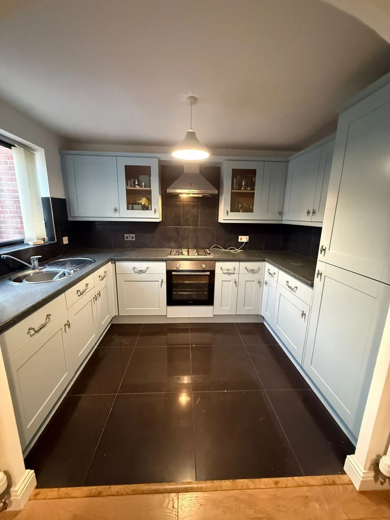 Grey U-shape kitchen cabinet respray - professional finish