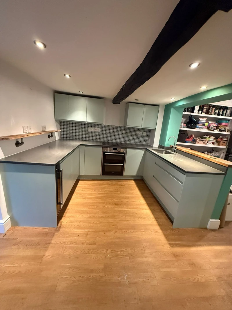 Mint green kitchen with exposed beams - cabinet respray