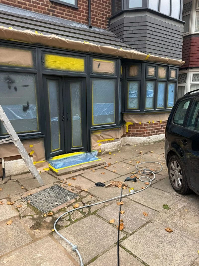 Bay window before respray - faded uPVC frames